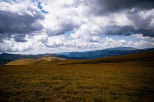 Cloudy day on the mountain cliff photo