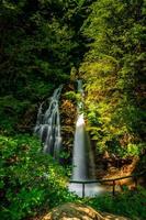 Natural waterfall in the forest photo