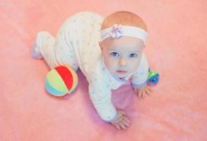 portrait of emotional sweet infant baby at home photo