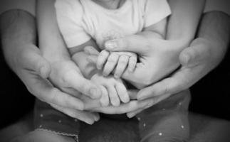 hands of complete family father, mother and child. Relationship photo