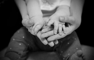 hands of incomplete family  father or mother and child. photo