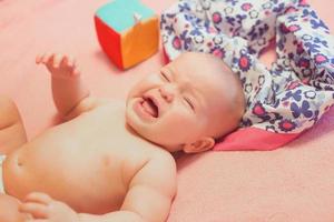 portrait of emotional sweet infant baby at home photo