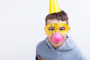 Cheerful boy in a funny outfit for the April Fool's Day. April 1st celebration concept photo