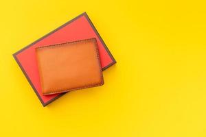 New leather brown men wallet on yellow photo