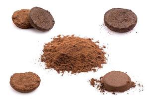 Ground coffee from coffee machine isolated on white background photo