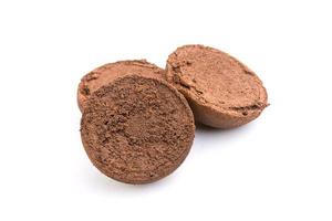 Ground coffee from coffee machine isolated on white background photo