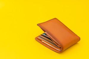 New leather brown men wallet on yellow photo