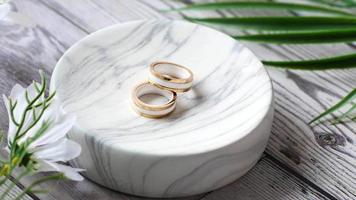 wedding ring in a box on wooden background video