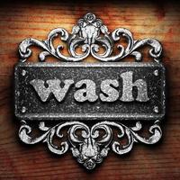 wash word of iron on wooden background photo