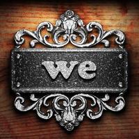 we word of iron on wooden background photo