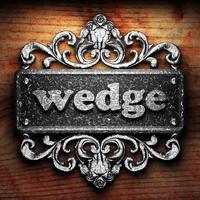 wedge word of iron on wooden background photo