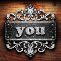 you word of iron on wooden background photo