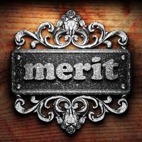 merit word of iron on wooden background photo