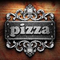 pizza word of iron on wooden background photo