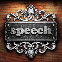 speech word of iron on wooden background photo