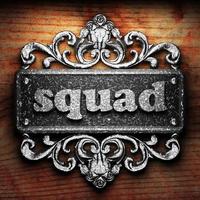 squad word of iron on wooden background photo
