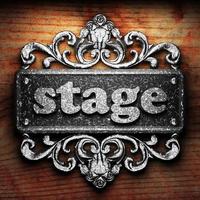 stage word of iron on wooden background photo