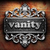 vanity word of iron on wooden background photo