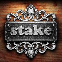 stake word of iron on wooden background photo