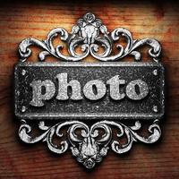 photo word of iron on wooden background