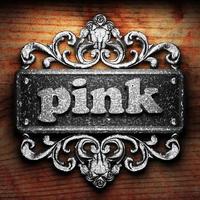 pink word of iron on wooden background photo