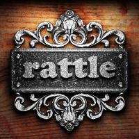 rattle word of iron on wooden background photo