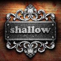 shallow word of iron on wooden background photo