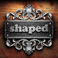 shaped word of iron on wooden background photo