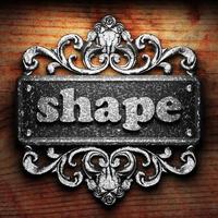 shape word of iron on wooden background photo