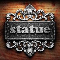 statue word of iron on wooden background photo