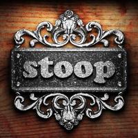 stoop word of iron on wooden background photo