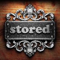 stored word of iron on wooden background photo