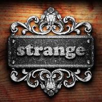 strange word of iron on wooden background photo