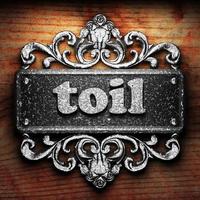 toil word of iron on wooden background photo