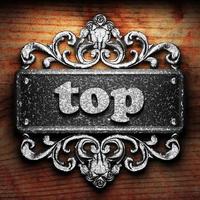 top word of iron on wooden background photo