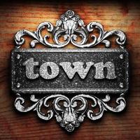 town word of iron on wooden background photo