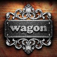 wagon word of iron on wooden background photo