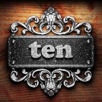 ten word of iron on wooden background photo