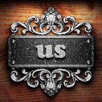 us word of iron on wooden background photo