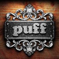 puff word of iron on wooden background photo