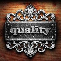 quality word of iron on wooden background photo