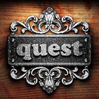 quest word of iron on wooden background photo