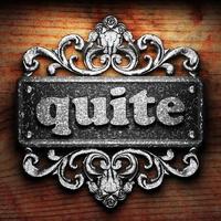 quite word of iron on wooden background photo