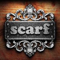 scarf word of iron on wooden background photo