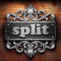 split word of iron on wooden background photo