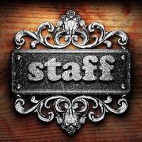 staff word of iron on wooden background photo