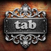 tab word of iron on wooden background photo