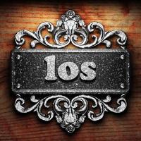 los word of iron on wooden background photo