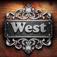 West word of iron on wooden background photo