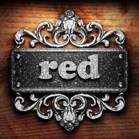 red word of iron on wooden background photo